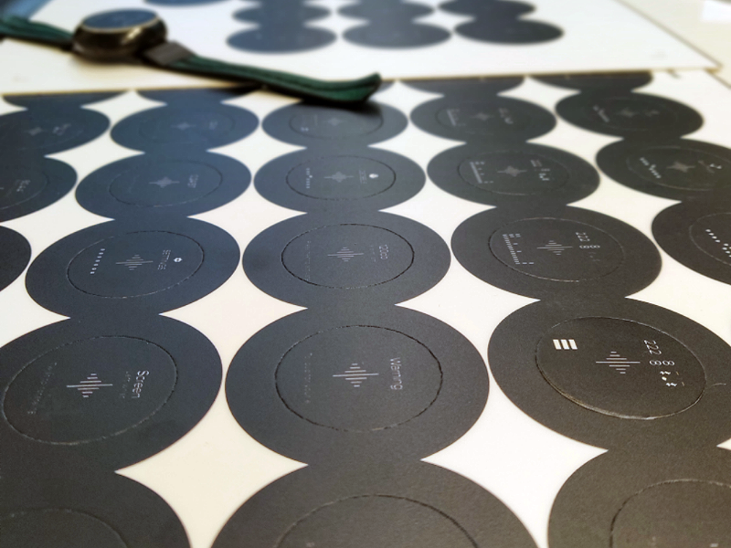 UI printed on black cutouts to simulate real LCD screens